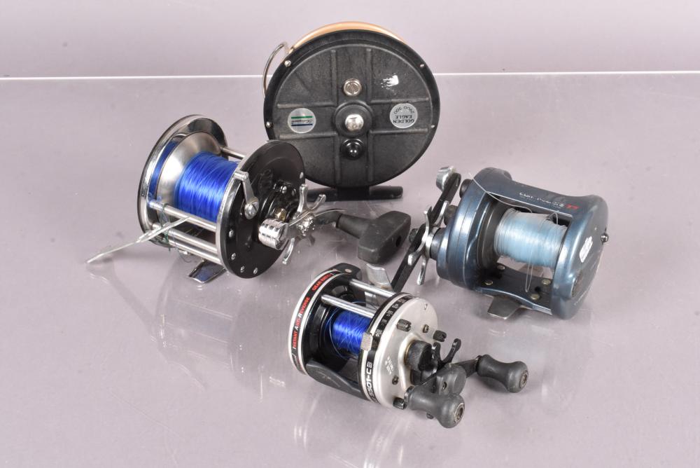 A group of four fishing reels, to include a Shakespeare Golden