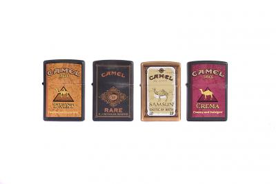 A collection of yellow-metal Camel Trophy Zippo Lighters, to 