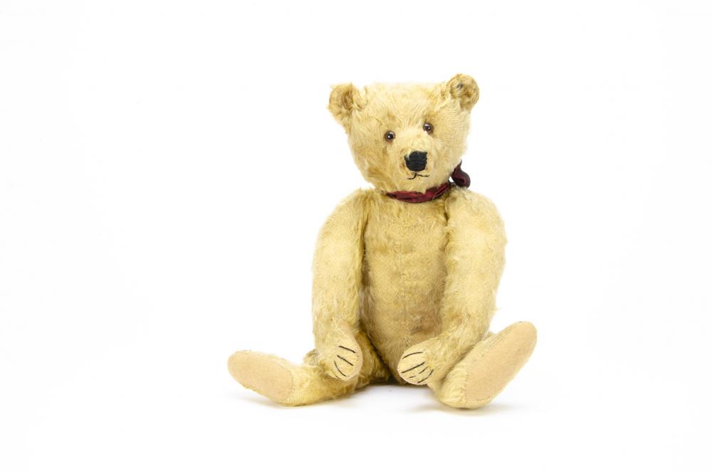 A German teddy bear 1910-1920s, with golden yellow mohair, closely