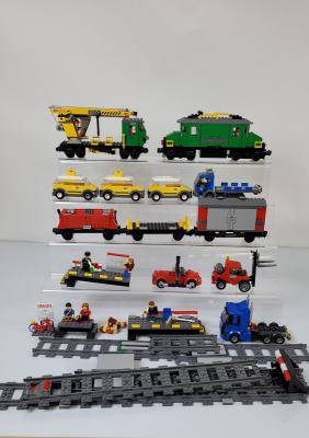 A collection of unboxed and unchecked Lego including Cargo Train Deluxe 7898 with some duplicates and some manuals, High Speed Passenger Train 60051 with some duplicates and manuals, Train Station 7937 and
